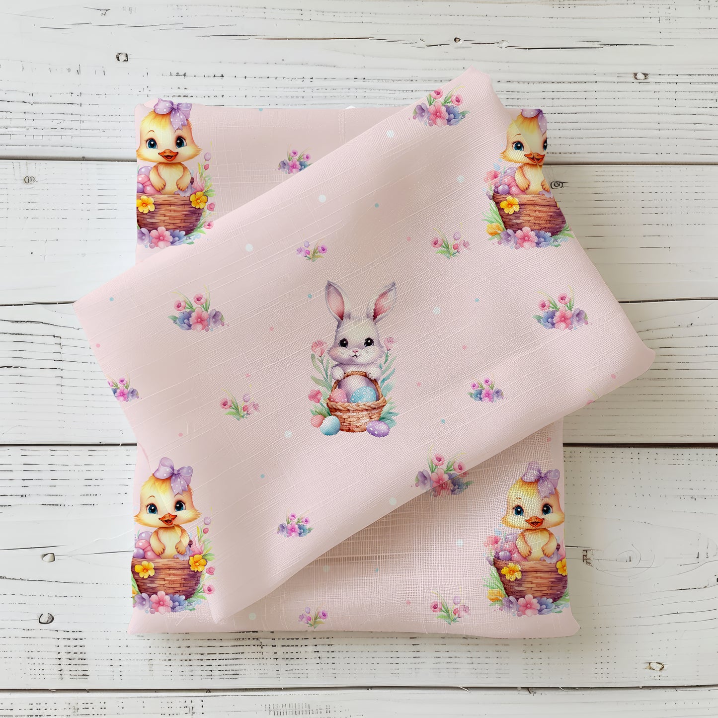 Jersey Osterstoff in rosa mit Küken und Osterhase in körben. Dazu noch dezente blumen