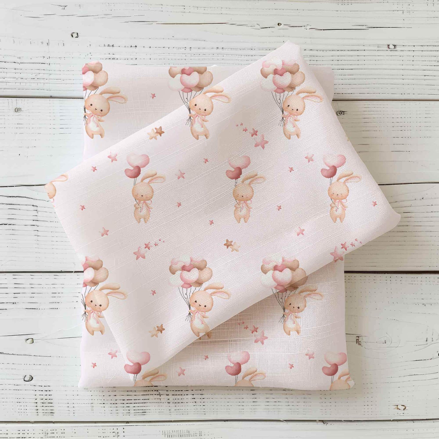 Süßer Jersey oder French Terry Stoff mit Osterhase, herz Ballon und Sternen Details auf rosa Hintergrund, perfekt für kreative Nähprojekte